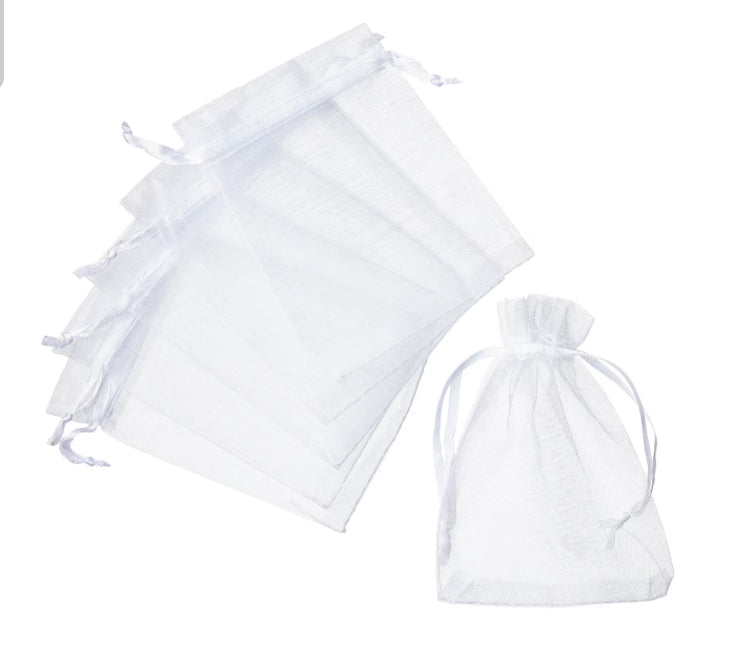 White drawstring bags on a white background